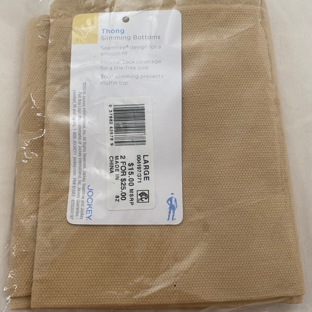 Nwt unopened package, jockey slimming thong Large